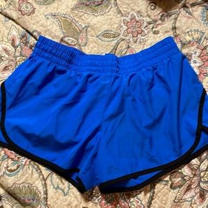 Blue and black Walmart brand athletic shorts. Size large